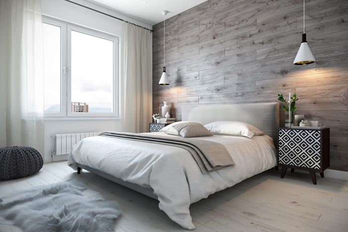 Am Kopfende des Bettes befindet sich eine Akzentwand. Hier kann ein helles Bild oder eine Komposition aus natürlichen Materialien wie Holz platziert werden.