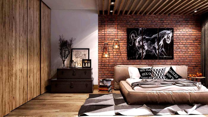 Der Einbauschrank ist hinter Holzvertäfelungen versteckt und das Bett besteht aus Ledermatten, die dem Stil entsprechen. Zusätzlicher Stauraum ist ein Paar Truhen neben dem Bett